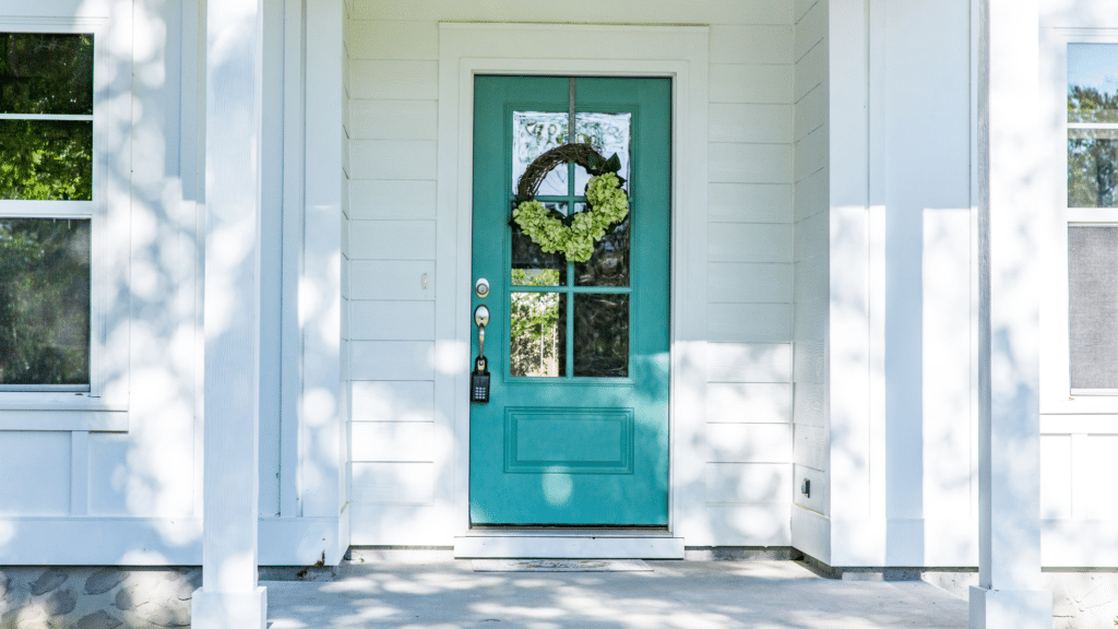 front porch with blue door